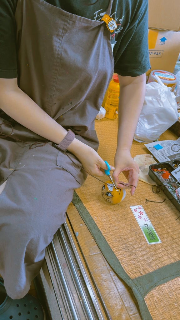 Staff assembling the Edo wind chime.